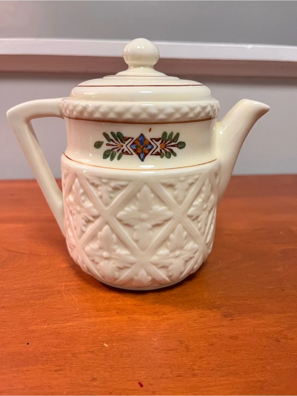 Ivory Embossed Ceramic Teapot with Floral Detail